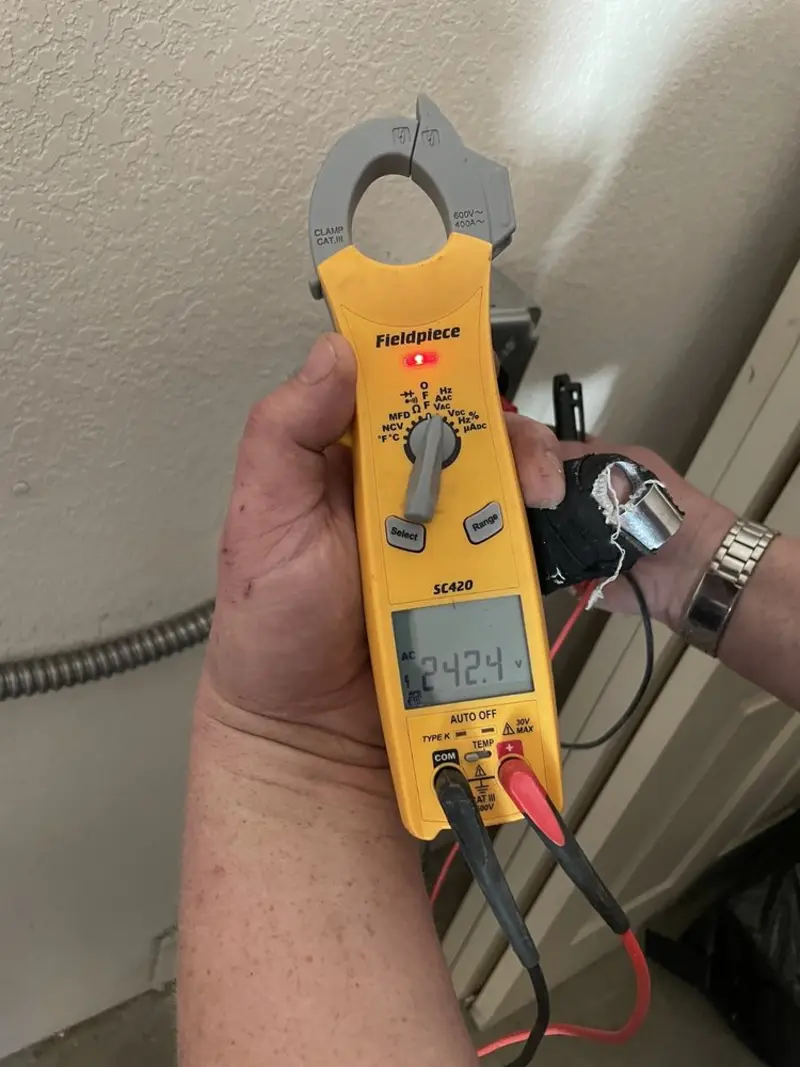 Voltage testing with clamp meter during Generator Installation in Londonderry